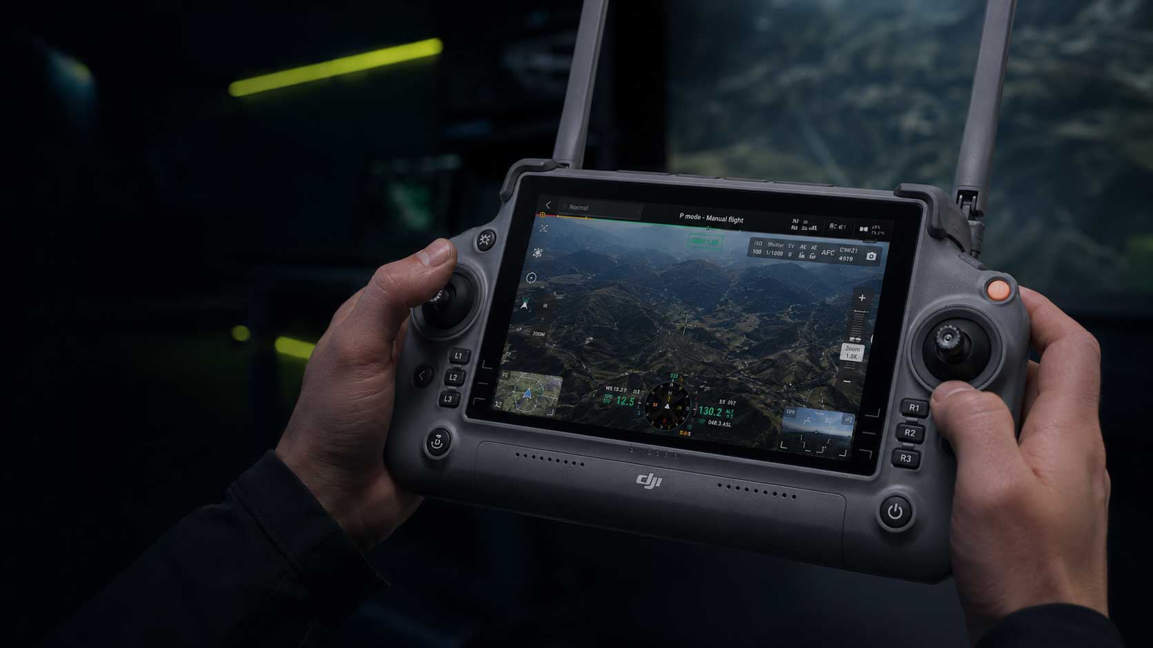 Hands operating a professional drone controller